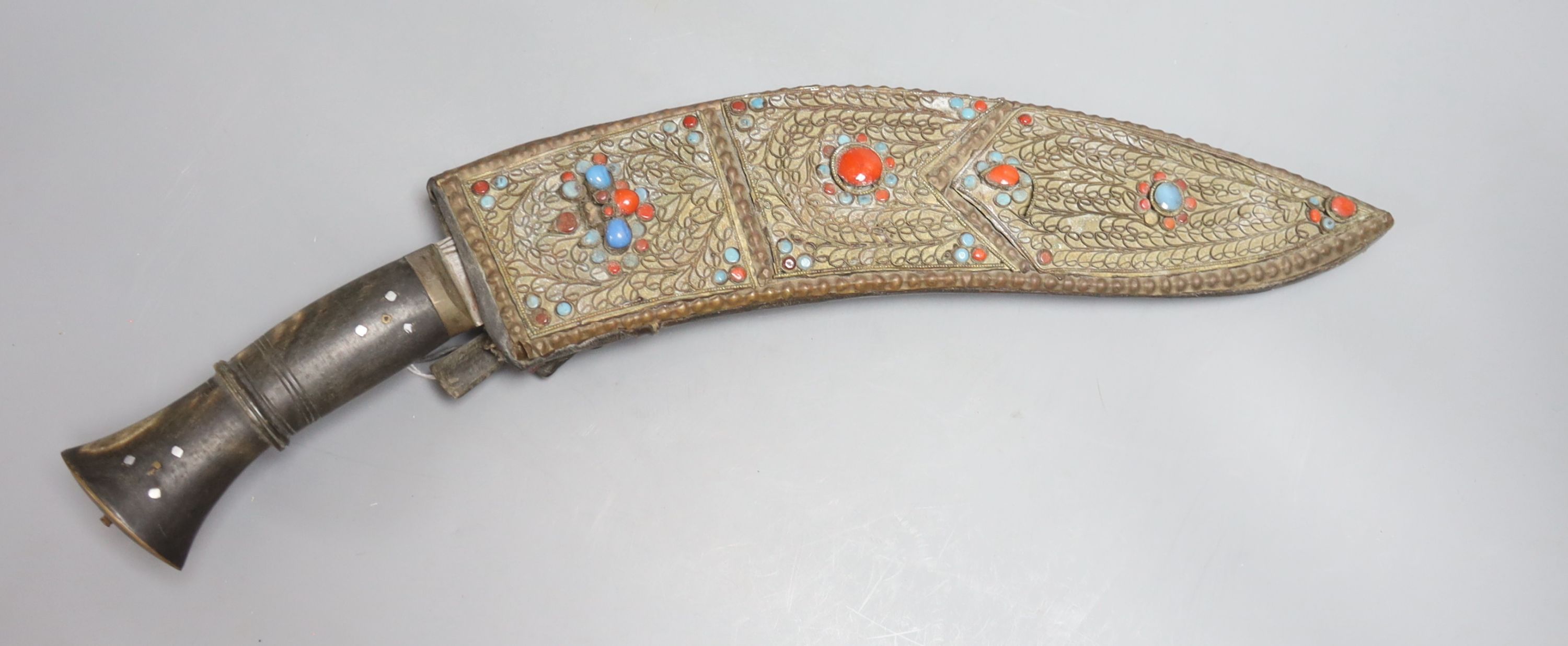 A Burmese curved kukri with hardstone inlaid sheath